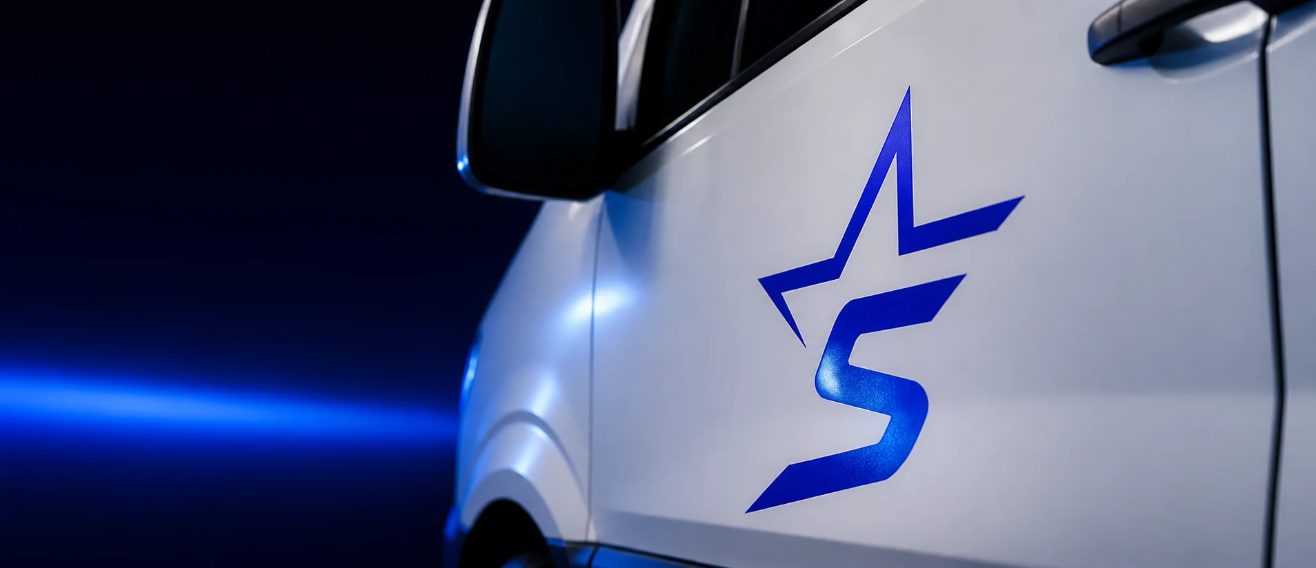 Close-up of the Star-S star logo on the side of the van